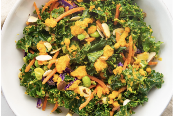 Elevate your lunch with our colourful Asian Kale Salad featuring shredded kale, crisp red cabbage, protein-rich edamame, shredded carrots and toasted almonds. The real star though is our house-made carrot-ginger dressing that brings a bright, colourful, subtly sweet finish to every bite.